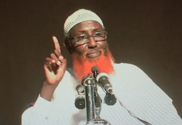 This picture taken on September 1, 2016, in Nairobi shows a computer screen displaying the portrait of Somali-born cleric Abdulqadir Mumin, accused of heading the Islamic State group in East Africa.