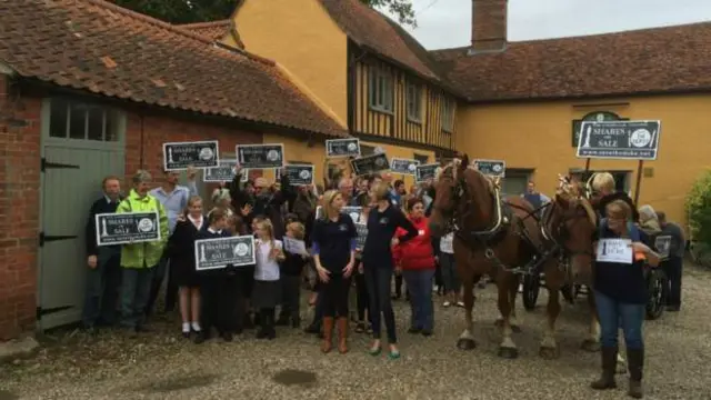 Campaigners with placards