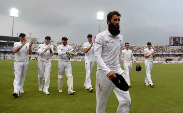 Moeen Ali and the England players walk off