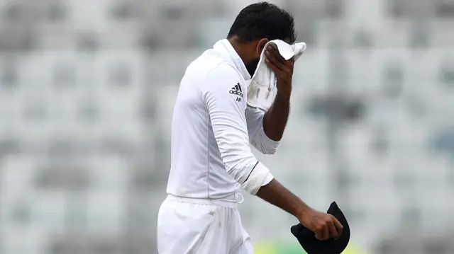 Adil Rashid mops his brow