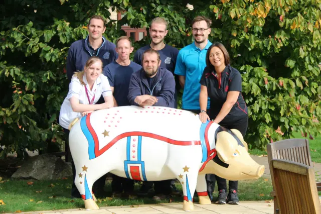 Elvis Porksley with hospice staff and members of the Neptune Marina team