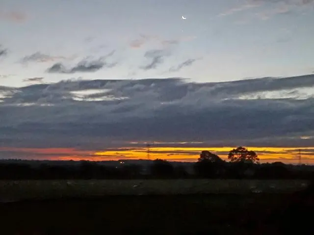 Sunrise over a field in Pattishall, Northamptonshire