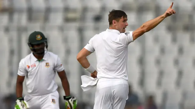 Chris Woakes celebrates the wicket of Hom