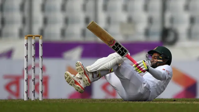 Mushfiqur Rahim falls after being hit by a delivery