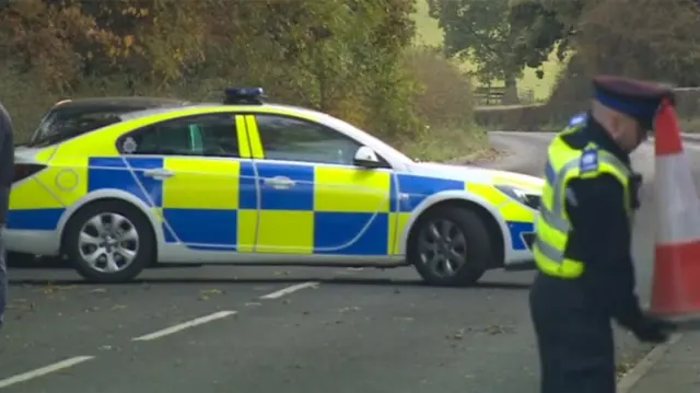 A police car turning on the road