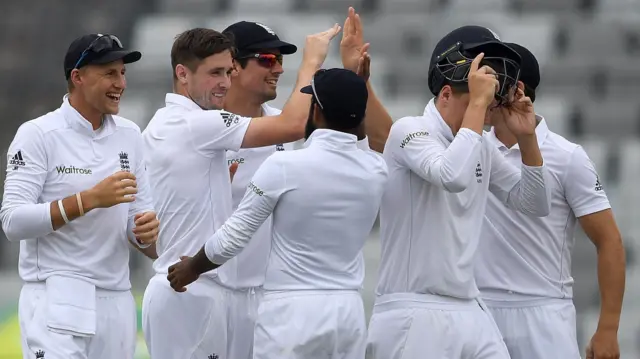 England players celebrate the wicket of Imrul Kayes