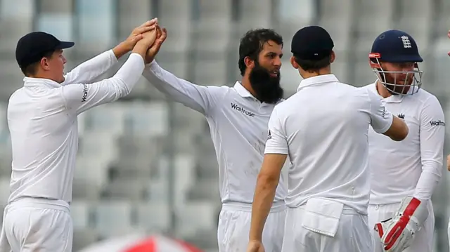 England's players celebrate a wicket