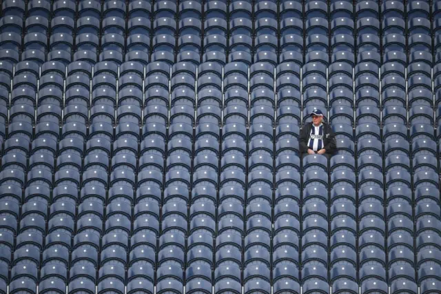 A fan sits alone