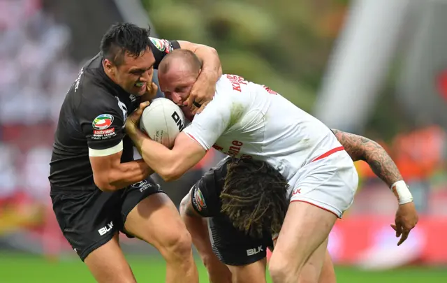 England"s Dan Sarginson is tackled by New Zealand"s Thomas Leuluai during the Ladbrokes Four Nations match at the John Smith"s Stadium, Huddersfield.