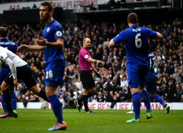 Referee Robert Madley points the penalty spot