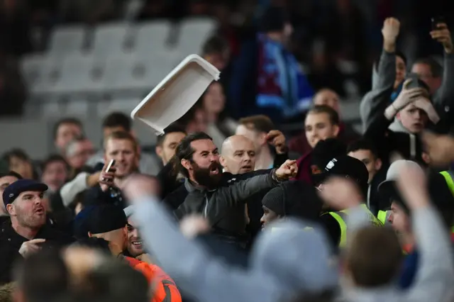 West Ham fans throw chairs