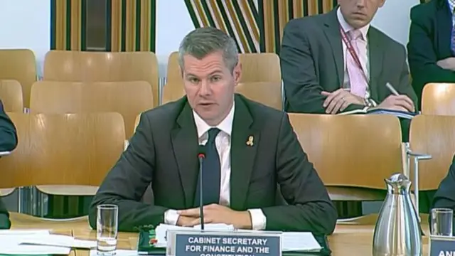 Finance Secretary Derek Mackay has defended the delay in committee