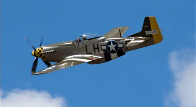 Mustang in flight, showing pilot in cockpit at Old Buckenham