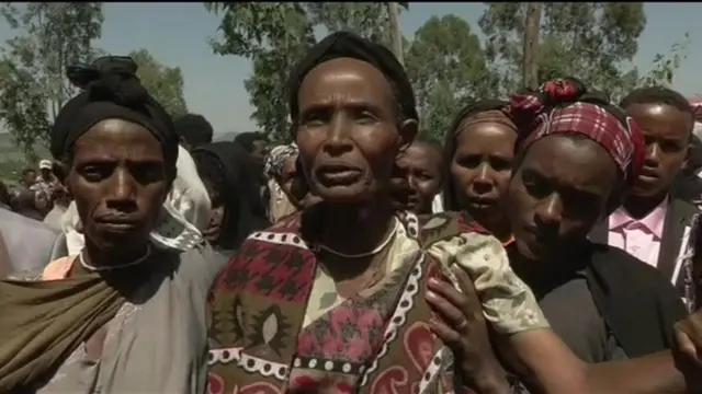 Woman speaking at funeral