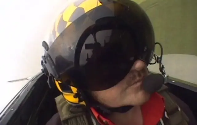 Maurice Hammond in the cockpit, flying the Mustang