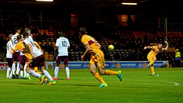 Motherwell's James McFadden scores with a free-kick against Hearts