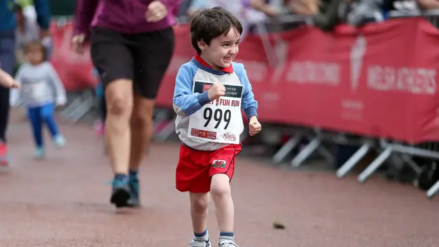 A child enjoying the Cardiff half Marathon fun run on Saturday