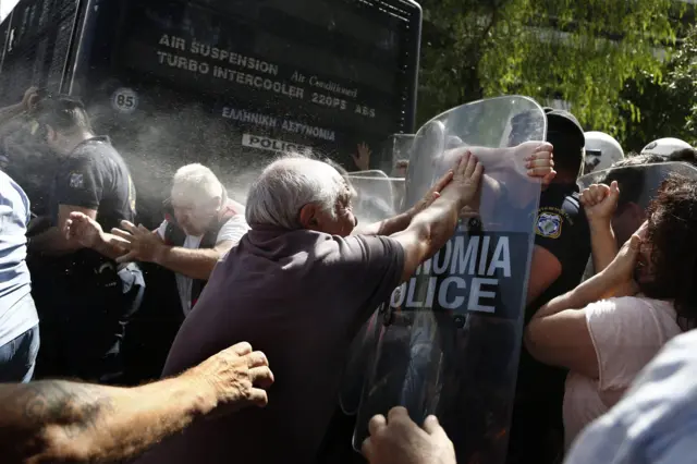 Greek riot policemen use tear gas as they try to disperse pensioners taking part in an anti-austerity protest against planned pension cuts, near the prime minister"s office in central Athens, Greece, 03 October 2016