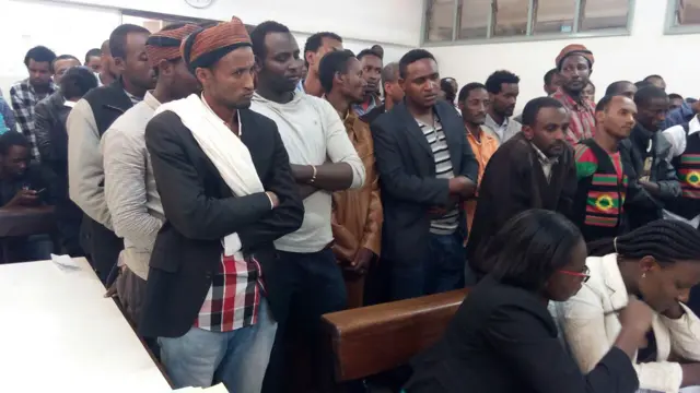 Oromo protesters standing up in court