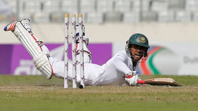 Mehedi Hasan dives to avoid a run out