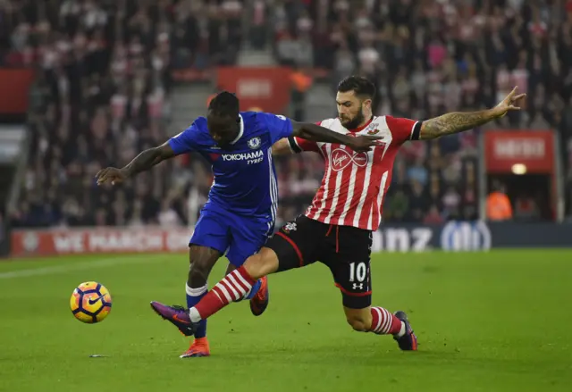 Charlie Austin tackles Victor Moses