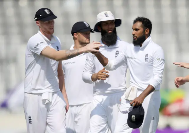 Adil Rashid is congratulated by his team mates