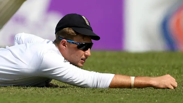 Joe Root reacts to a dropped catch