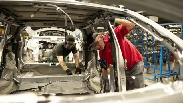 workers at a Nissan car plant