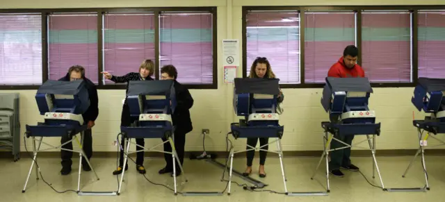 Voters cast their ballot during early voting at a polling station in Chicago, Illinois - 31 October 2016