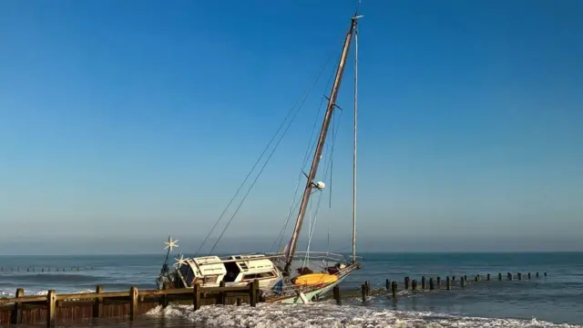 The yacht on a groyne