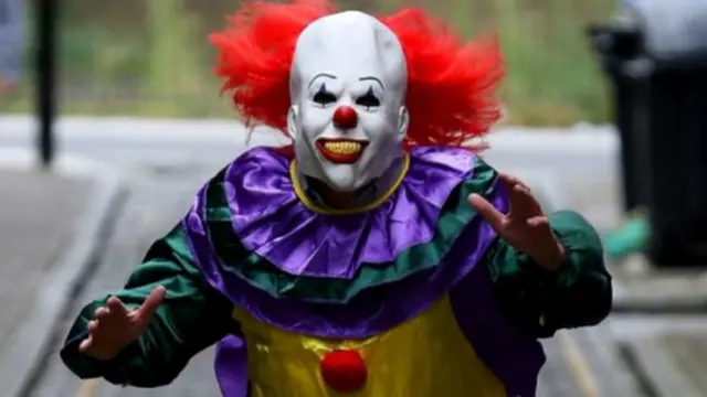 Person in a clown's outfit