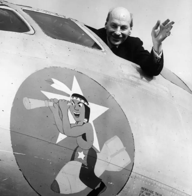 British Prime Minister Clement Attlee (1883-1967) waves from the cockpit of a US B50