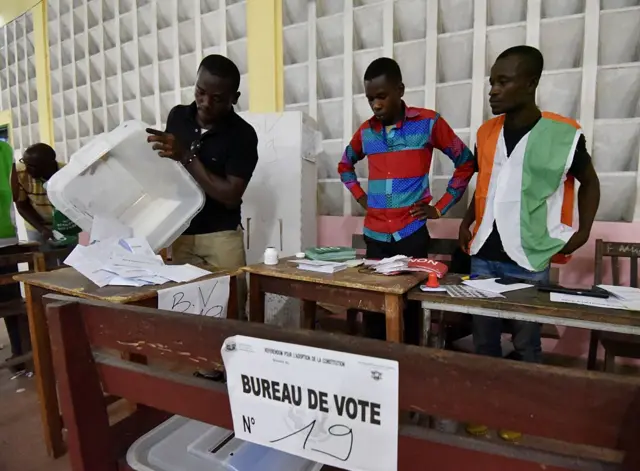 Counting ballots in a polling station in Ivory Coast