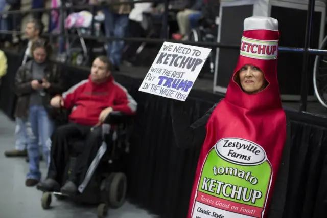 Sharon Rogowski of Byron Center, Michigan, waits for the arrival of Republican presidential candidate Donald Trump to a campaign rally.