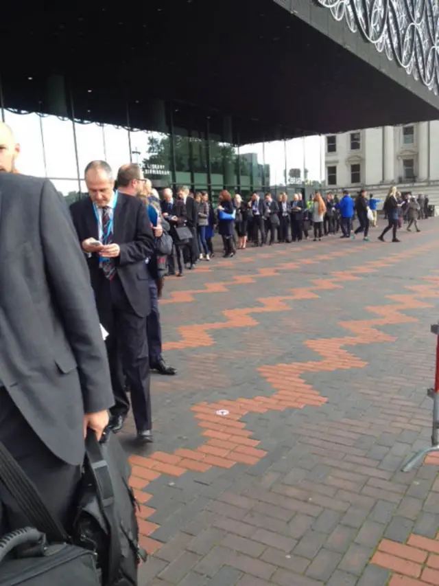 Conference attendees queueing