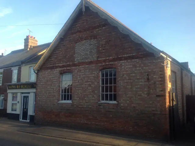 Street view of a brick house in Terrington St Clement