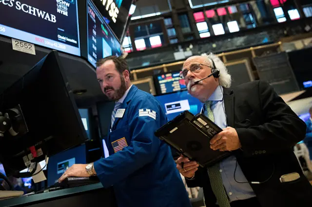 Traders and financial professionals work on the floor of the New York Stock Exchange