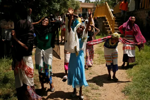 Women mourn during the funeral of Tesfu Tadese Biru, 32, a construction engineer who died during a stampede after police fired warning shots at an anti-government protest in Bishoftu during Irreecha, the thanksgiving festival of the Oromo people, in Denkaka Kebele, Ethiopia, October 3, 2016.