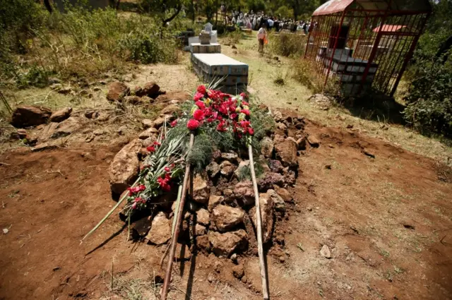 Fresh flowers are pictured on the grave of Tesfu Tadese Biru, 32, a construction engineer who died during a stampede after police fired warning shots at an anti-government protest in Bishoftu during Irreecha, the thanksgiving festival of the Oromo people, in Denkaka Kebele, Ethiopia, October 3, 2016.
