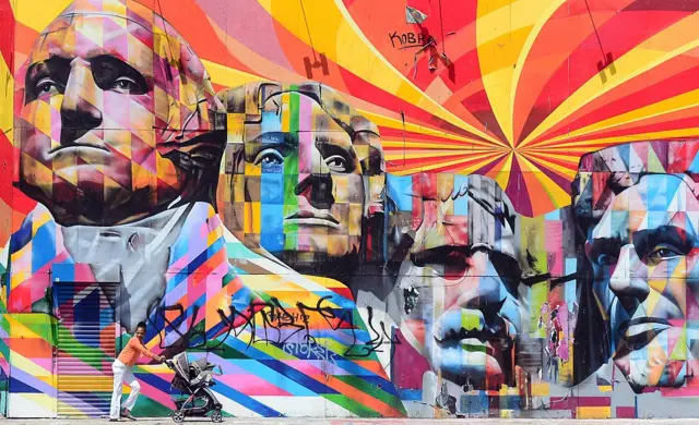 A colourful graffiti version of Mt Rushmore features on the streets of LA