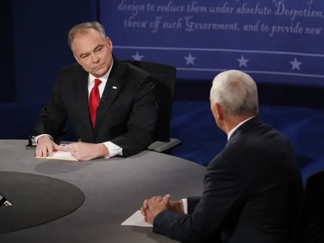 Republican vice-presidential nominee Gov. Mike Pence, right, speaks as Democratic vice-presidential nominee Sen. Tim Kaine listens during the vice-presidential debate at Longwood University in Farmville, Va.