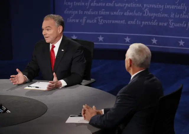 Republican vice-presidential nominee Gov. Mike Pence, right, listens to Democratic vice-presidential nominee Sen. Tim Kaine speak during the vice-presidential debate at Longwood University in Farmville, Va