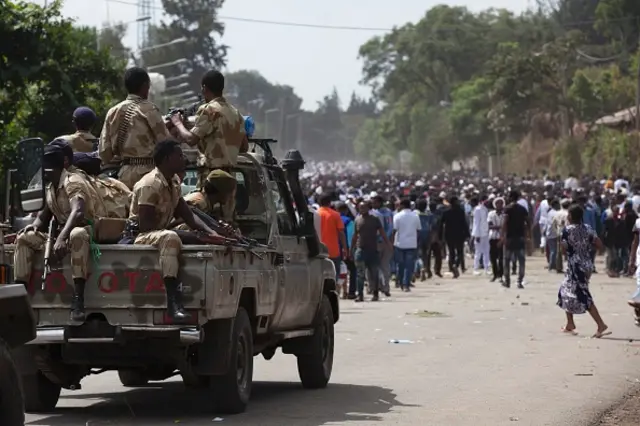 Oromo regional police officers wait in a pick up car during the Oromo new year holiday Irreechaa in Bishoftu on October 2, 2016.