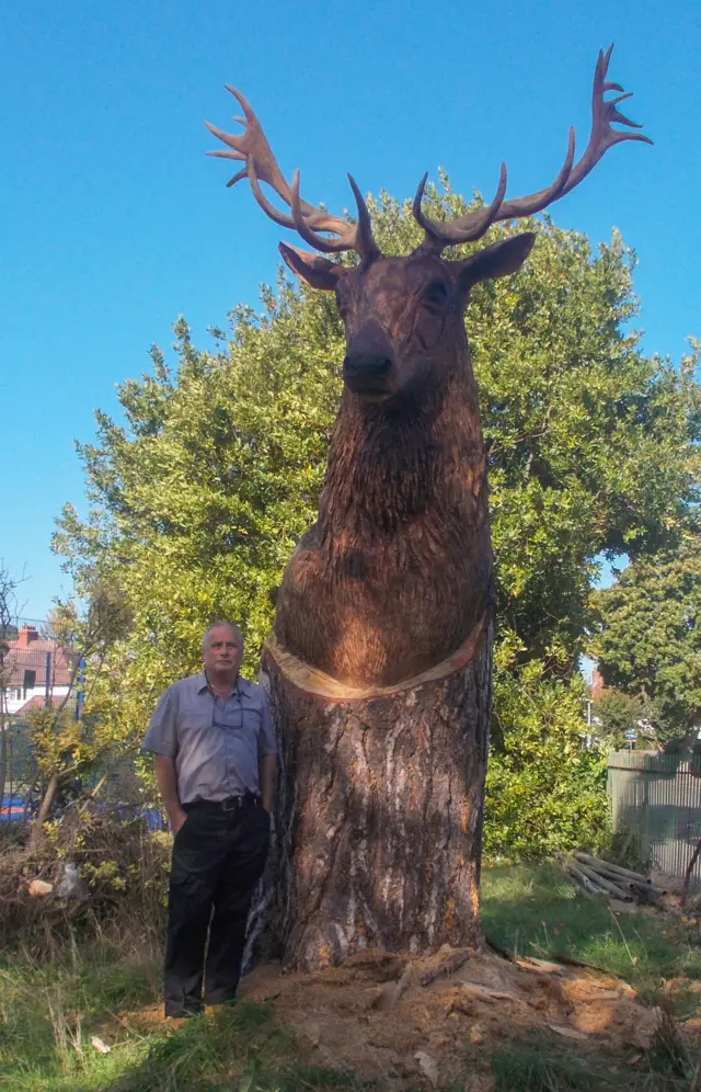 Peter Phillips and the stag carving