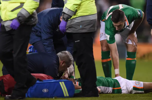 Robbie Brady receives medical attention