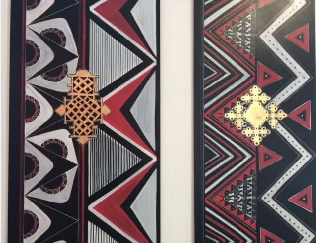 Art work in black, red, gold and white