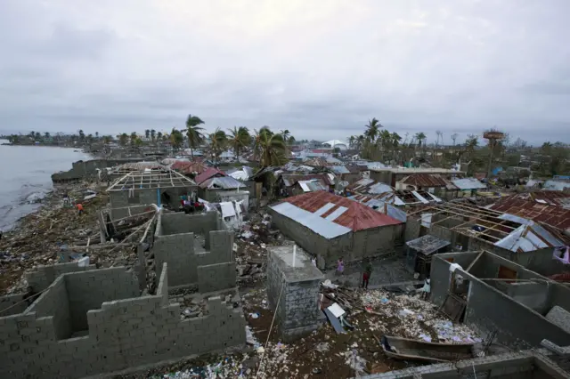 Homes lay in ruins after the passing of Hurricane Matthew in Les Cayes, Haiti, Thursday, Oct. 6, 2016