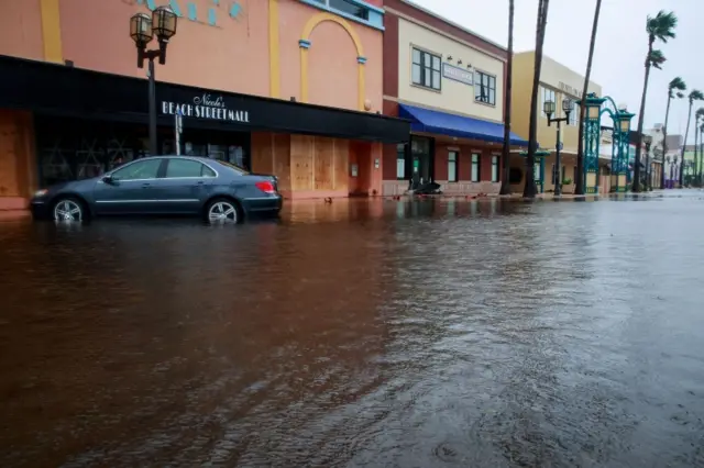 Water covers Beach Street in Daytona Beach, Florida