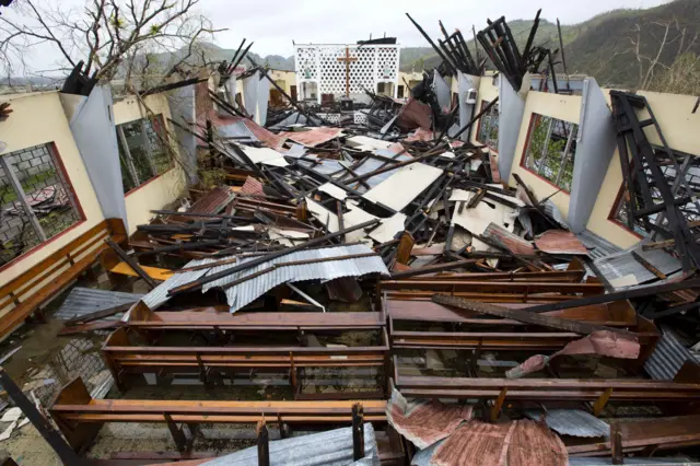 Saint Anne church lies totally destroyed by Hurricane Matthew in Camp Perrin, a district of Les Cayes, Haiti, Thursday, Oct. 6, 2016