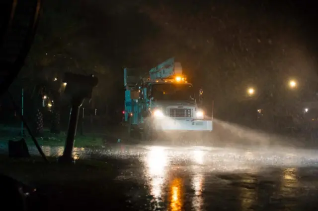 Truck from Florida Power and Light battles through Hurricane Matthew